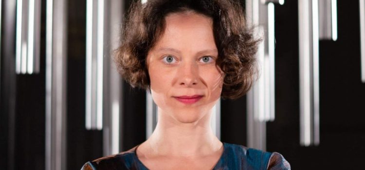 Anna-Maria Hefele standing below the Lambdoma after a recording session.